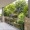 a spacious balcony overlooking many trees 